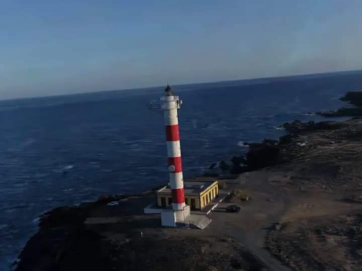 3D model of a lighthouse on a cliff, from a drone video